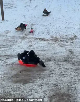 Viral Video Shows Oklahoma Police Officer Accidentally Sleds Into Child During Snow Day Chaos—Safety Message Emerges
