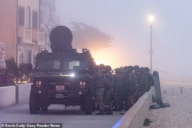 Transgender Woman in 'Blues Brothers' Costume Arrested After Seven-Hour Standoff at Retired Developer's Home; Murder Charge Alleged