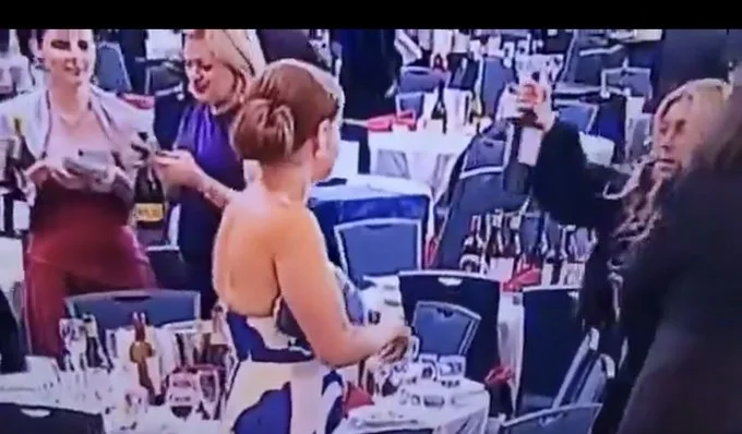 Viral footage identifies woman grabbing wine at DC shooting as Ukrainian Ambassador.