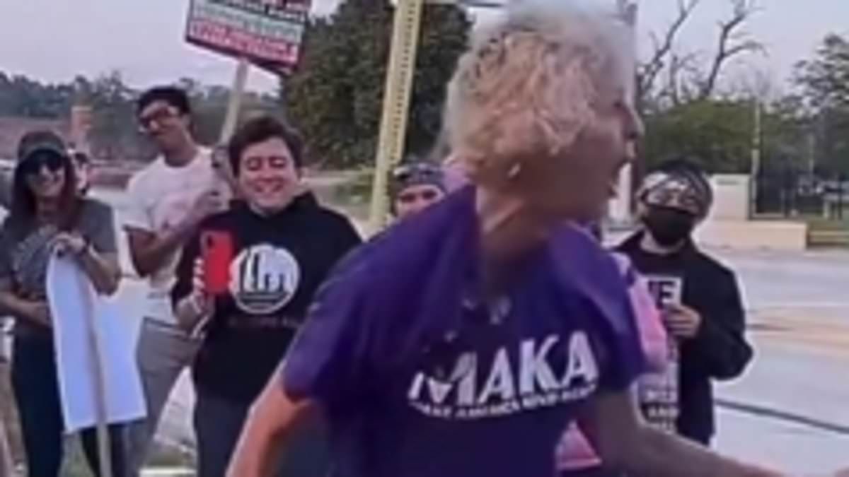 Protester strikes piñata of Trump while wearing 'Make America Kind Again' shirt