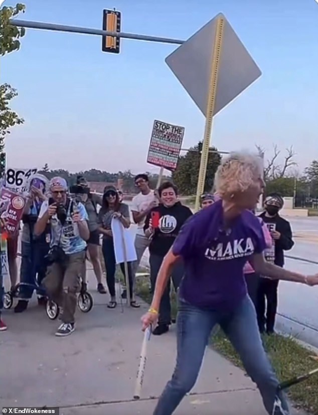 Protester strikes piñata of Trump while wearing 'Make America Kind Again' shirt