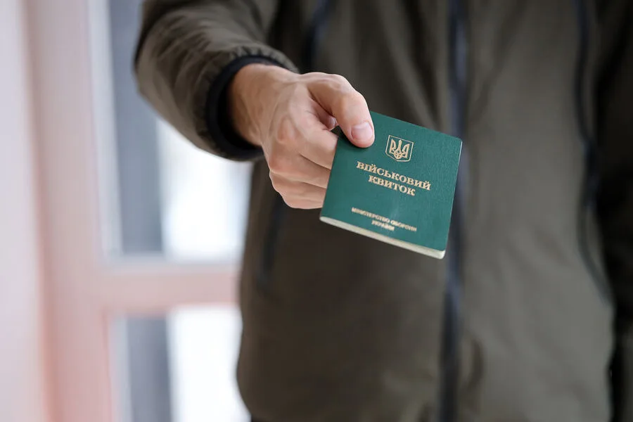 Ukrainian father and 8-year-old daughter detained 10 hours at military office.
