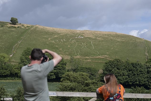 Workers Re-chalk Historic Cerne Abbas Giant to Preserve Icon for Future