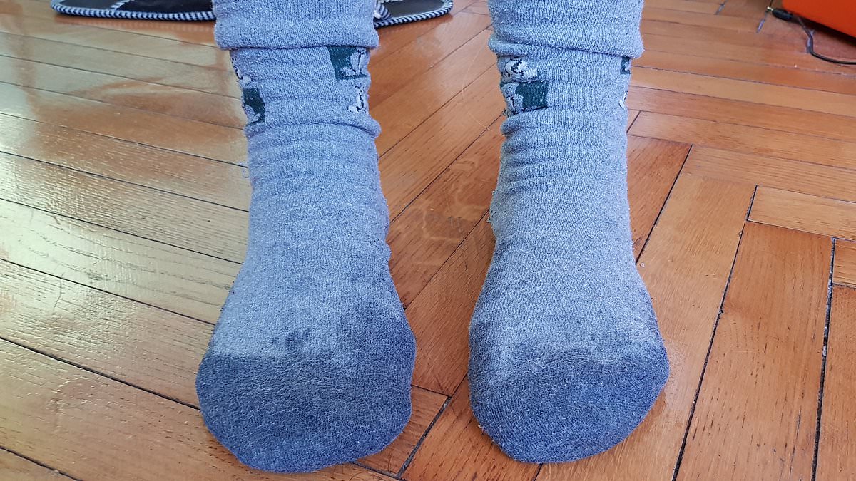 Sleep specialist advises damp socks to cool feet during UK heatwave.