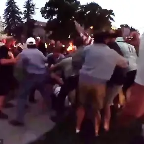 Candlelight Vigil for Charlie Kirk Disrupted by E-Bike Rider's Slur, Leading to Violent Confrontation