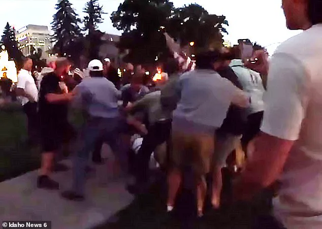 Candlelight Vigil for Charlie Kirk Disrupted by E-Bike Rider's Slur, Leading to Violent Confrontation